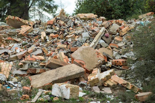 Abandoned construction site with broken bricks and concrete rubble.